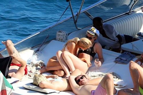 Kristen Stewart Bikini Pictures Kristen Stewart and Stella Maxwell sexy lesbians making out on a boat in bikinis seen by paparazzi.