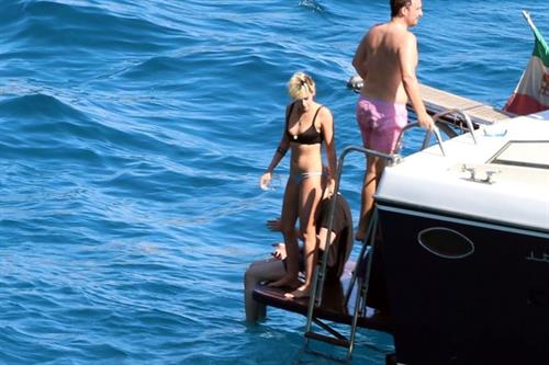 Kristen Stewart and Stella Maxwell sexy lesbians making out on a boat in bikinis seen by paparazzi.










