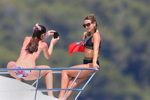 Sam Faiers Bikini Pictures Sam Faiers sexy in a black versace bikini seen by paparazzi showing nice cleavage.