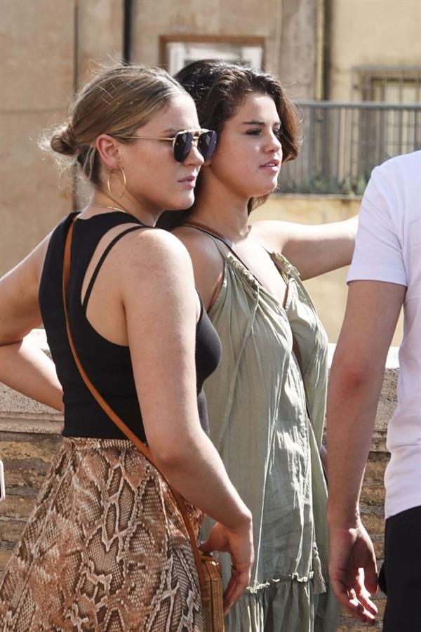 Selena Gomez braless and sexy in a dress seen by paparazzi in Rome.


