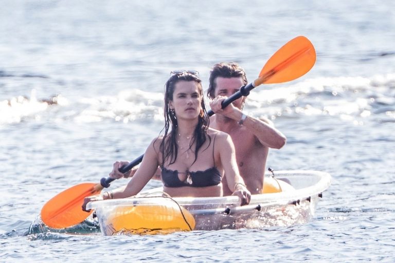 Alessandra Ambrosio Bikini Pictures Alessandra Ambrosio sexy at the beach in a thong bikini and flashing her pussy to her boyfriend seen by paparazzi.