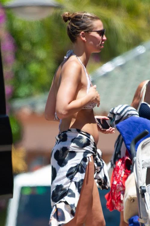 Ferne McCann Bikini Pictures Ferne McCann sexy in a bikini at the beach seen by paparazzi showing some cleavage.