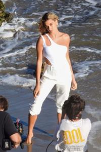 Hailey Bieber braless nipples pokies in a white top at the beach seen by paparazzi during a photo shoot.



















