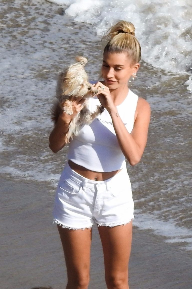Hailey Bieber braless nipples pokies in a white top at the beach seen by pa...