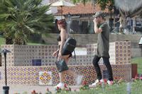 Ariel Winter paparazzi pictures in black bikini top and short skirt