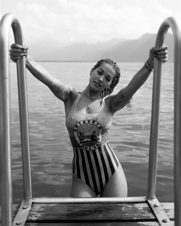 Rita Ora big tits in a wet swimsuit getting out of the water showing off her boobs.
































