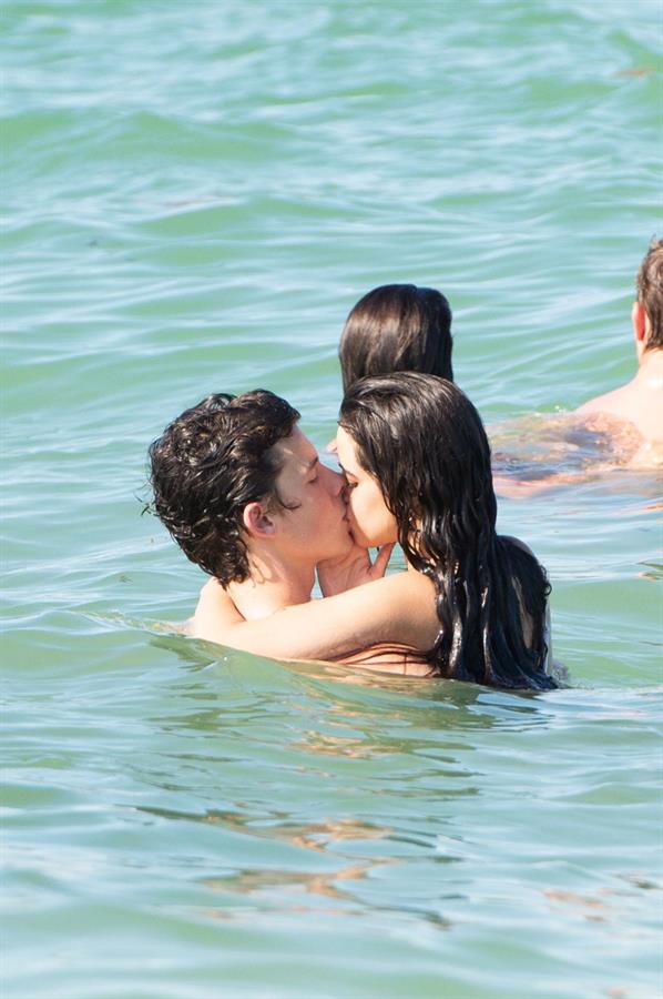 Camila Cabello and Shawn Mendes making out in the water seen by paparazzi kissing.





































