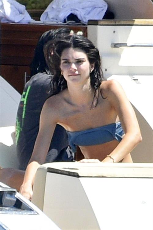 Kendall Jenner Bikini Pictures Kendall Jenner in a sexy bikini swimsuit on a yacht with Kourtney Kardashian seen by paparazzi.