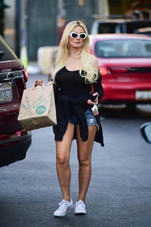 Holly Madison braless boobs in a see through black top seen by paparazzi showing off her big boobs.




