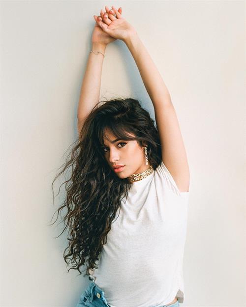Camila Cabello Pictures Camila Cabello braless boobs in a see through white top showing her tits.