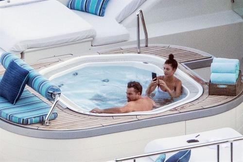 Camila Morrone Bikini Pictures Camila Morrone in a sexy swimsuit in a hot tub on a yacht with Leonardo DiCaprio seen by paparazzi.