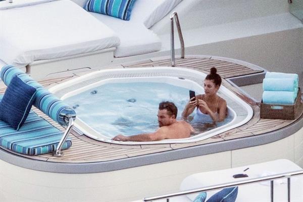 Camila Morrone in a sexy swimsuit in a hot tub on a yacht with Leonardo DiCaprio seen by paparazzi.










