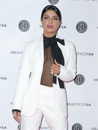 Priyanka Chopra braless boobs in a see through top showing some nice cleavage at Beautycon.

