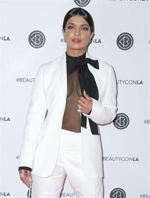 Priyanka Chopra braless boobs in a see through top showing some nice cleavage at Beautycon.


