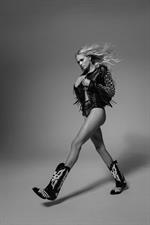 Vita Sidorkina nude photo shoot for Maxim holding her topless boobs.


