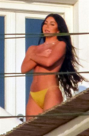 Martha Kalifatidis caught topless by paparazzi with her hand covering her nude big boobs.





