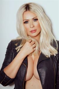Nicola McLean nude boobs in just a jacket showing some nice cleavage in a new photo shoot.







