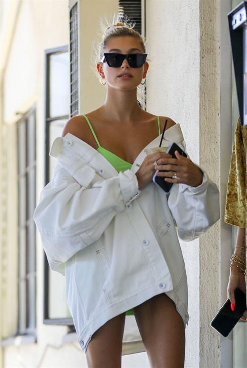 Hailey Bieber Pictures Hailey Baldwin sexy in a green dress and jacket seen by paparazzi.