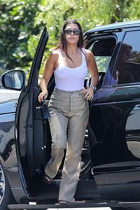 Kourtney Kardashian braless boobs in a see through white top seen by paparazzi showing off her tits.



















