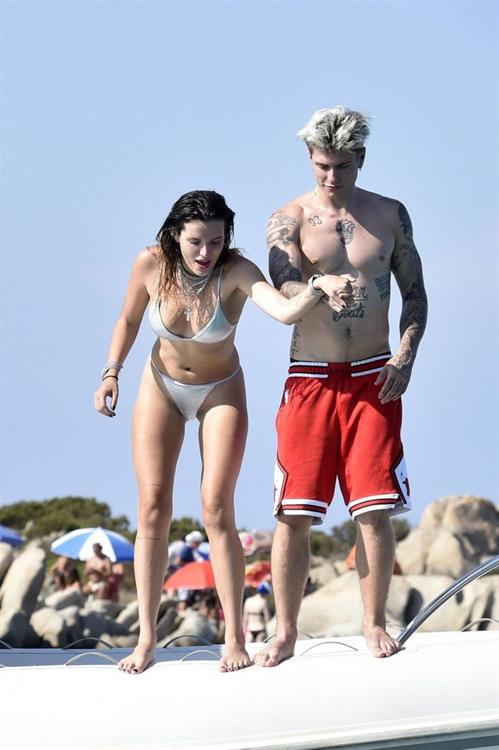 Bella Thorne sexy in a thong bikini drinking and smoking weed out on the water showing off her ass seen by paparazzi.



