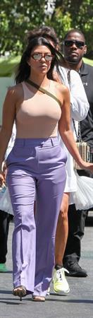 Kourtney Kardashian braless boobs in a nude tank top showing off her tits pokies with Kris Jenner seen by paparazzi.














