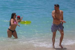 Stassi Schroeder and Katie Maloney-Schwartz sexy at the beach seen by paparazzi in a bikini and a swimsuit showing nice cleavage.