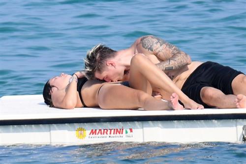 Bella Thorne Bikini Pictures Bella Thorne making out and having fun with her boyfriend in a sexy little bikini seen by paparazzi.