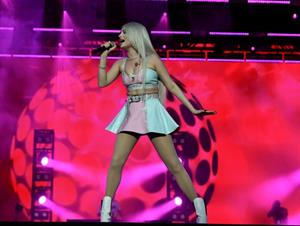 Kim Petras upskirt on stage singing and showing her panties.







