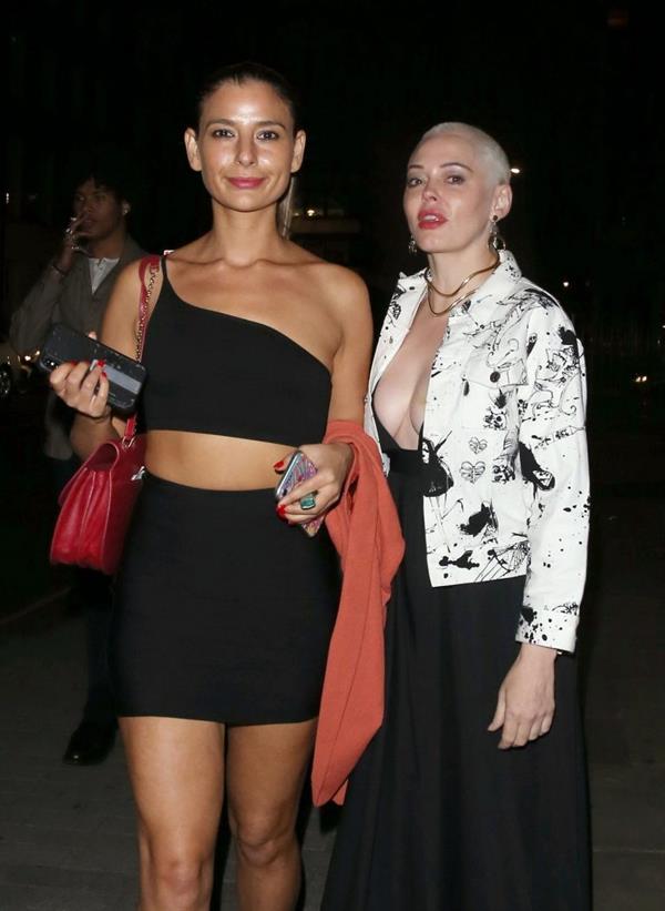 Rose McGowan braless boobs showing nice cleavage in a low cut dress with Lottie Moss seen by paparazzi. 