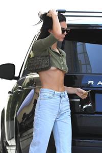Kendall Jenner braless boobs showing nice underboob cleavage seen by paparazzi in a revealing little top.




