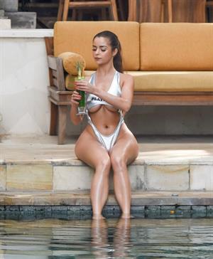 Demi Rose sexy ass booty and boobs showing nice cleavage and underboob in a playboy thong swimsuit photo shoot.





