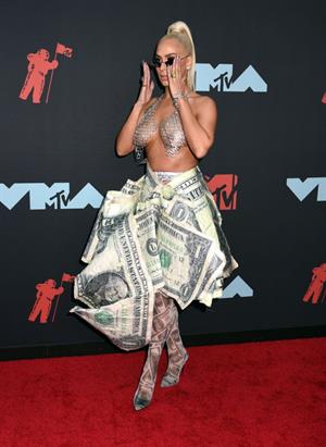 Veronica Vega showing off her braless boobs on the red carpet at the MTV VMA's in a see through top.














