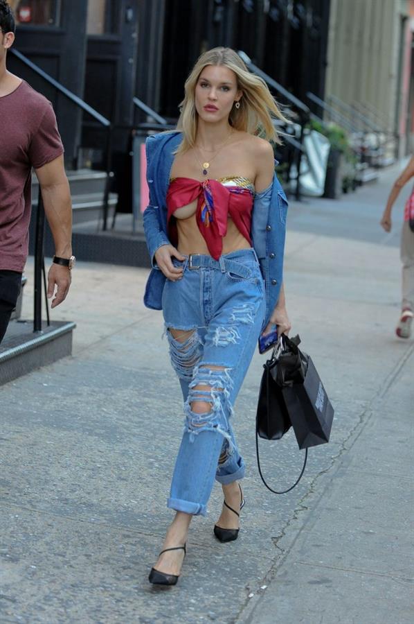Joy Corrigan braless boobs wearing just a scarf as a top showing nice underboob seen by paparazzi.


















