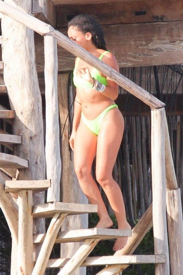 Vanessa Morgan in a tight green bikini showing nice cleavage and her sexy ass seen by paparazzi.




















