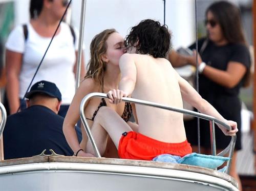 Lily-Rose Depp Bikini Pictures Lily-Rose Depp sexy ass in a little thong bikini making out with Timothee Chalamet on a boat seen by paparazzi.