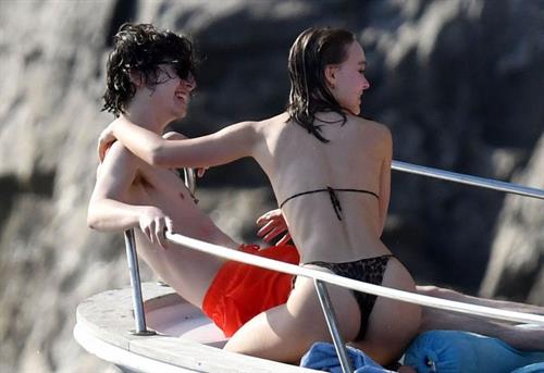 Lily-Rose Depp Bikini Pictures Lily-Rose Depp sexy ass in a little thong bikini making out with Timothee Chalamet on a boat seen by paparazzi.