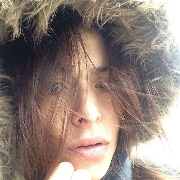 Sarah Shahi taking a selfie