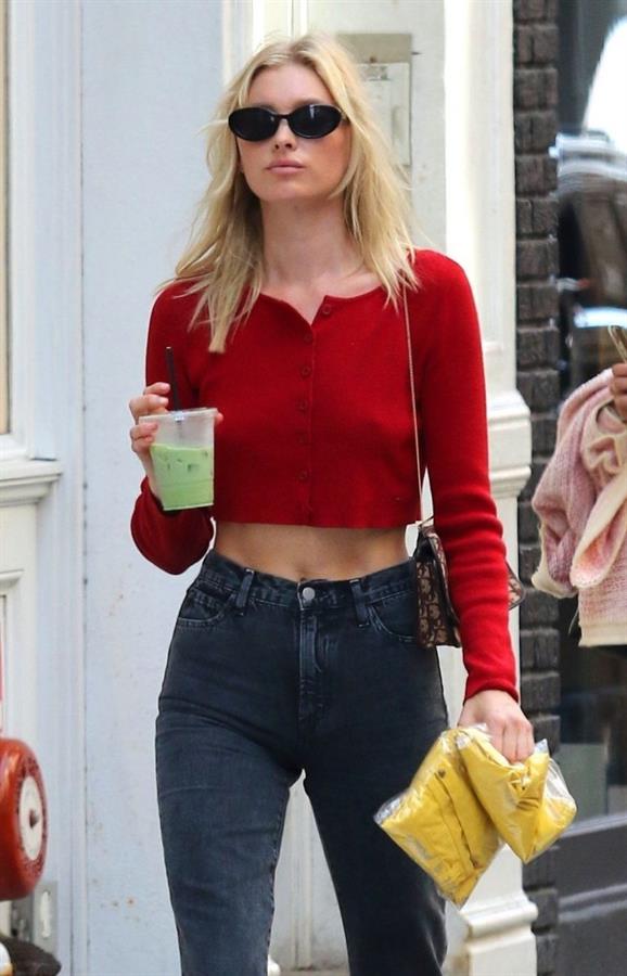 Elsa Hosk braless tits pokies in a little red top showing off her tits seen by paparazzi.





