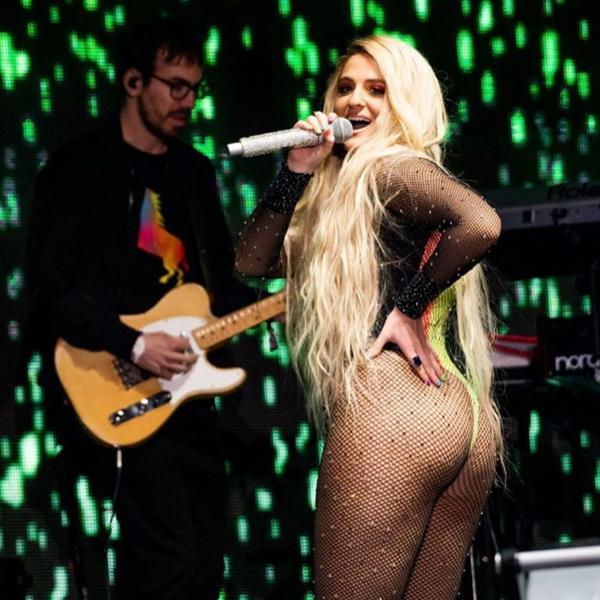 Meghan Trainor sexy ass on stage in a revealing thong outfit singing.























