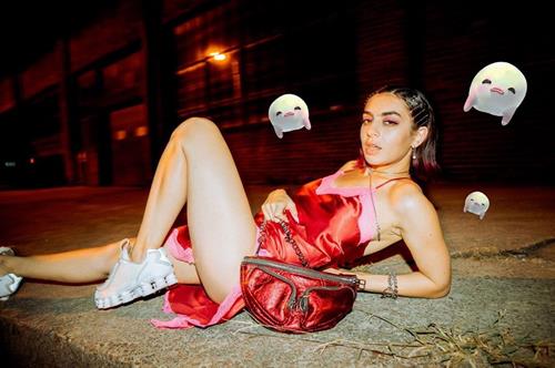Charli XCX Pictures Charli XCX sexy upskirt photo laying down with her dress pulled up high revealing her ass.