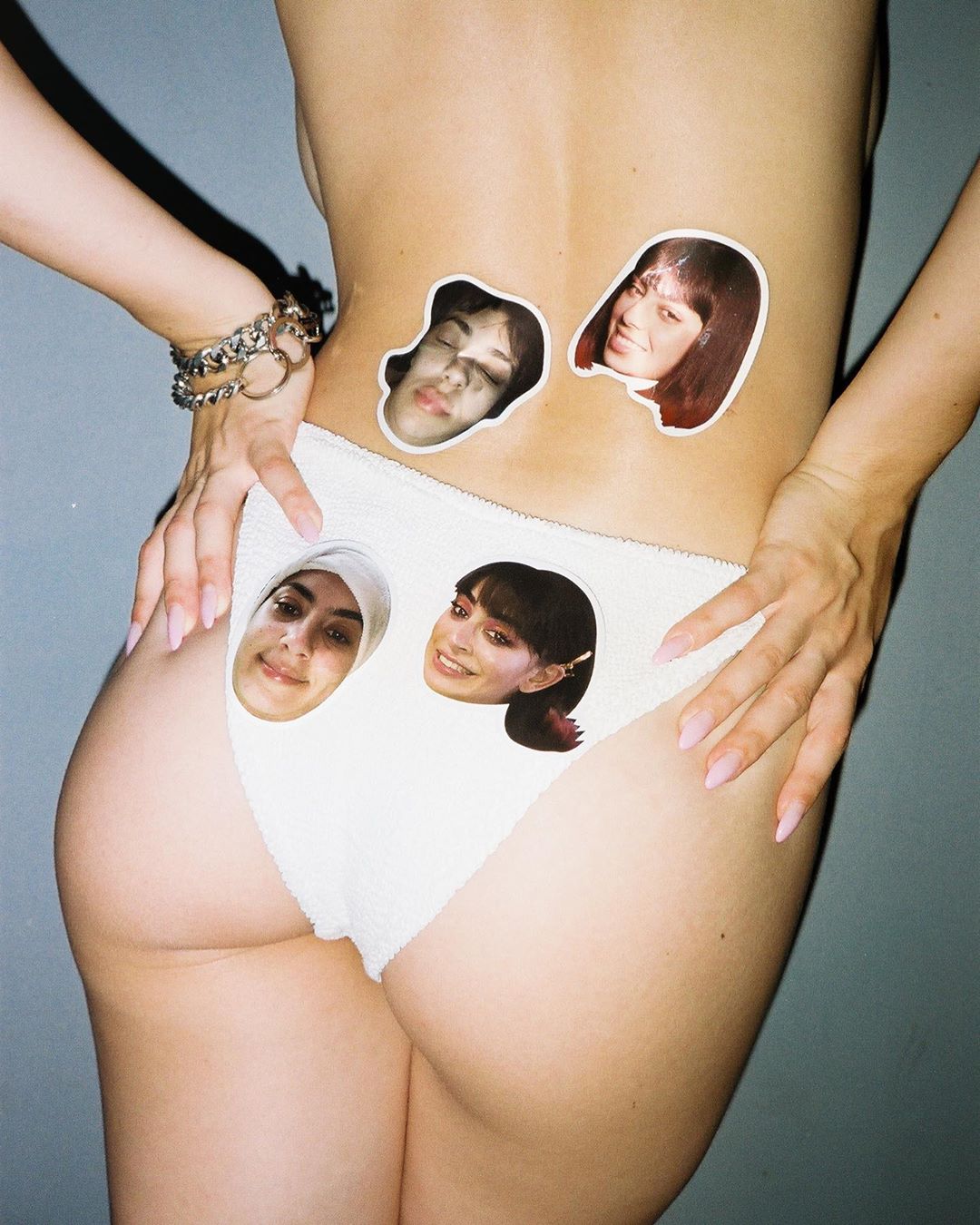 Charli XCX sexy ass in just panties to sell her sticker packs while she is topless.





















































