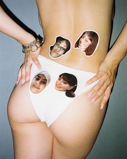 Charli XCX sexy ass in just panties to sell her sticker packs while she is topless.





















































