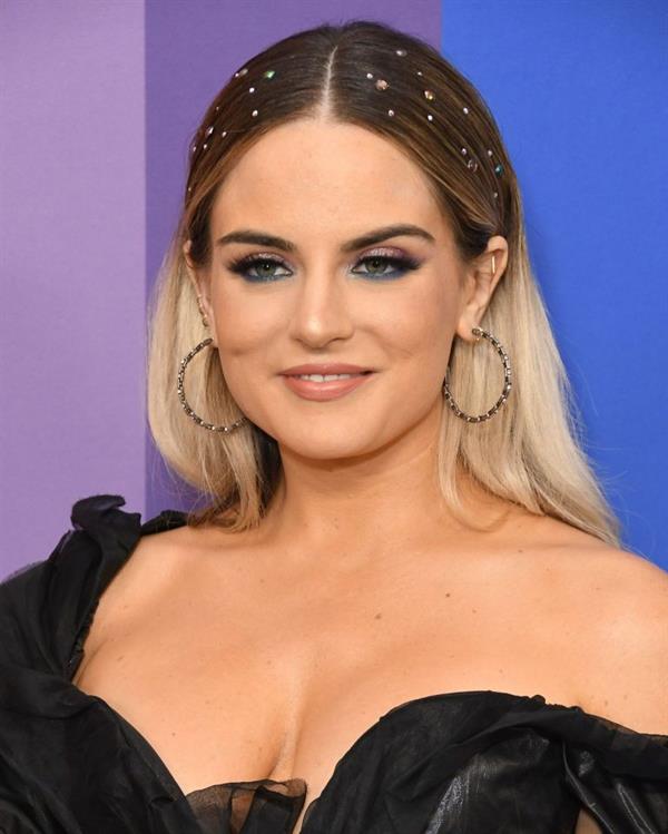 JoJo big braless boobs showing nice cleavage in a black dress photographed by paparazzi.















