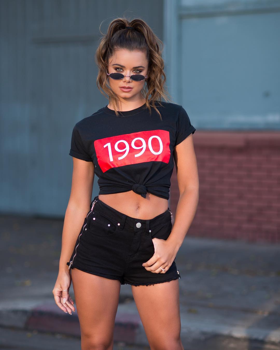 Dessie Mitcheson in Black Daisy Duke Shorts and a T-Shirt
