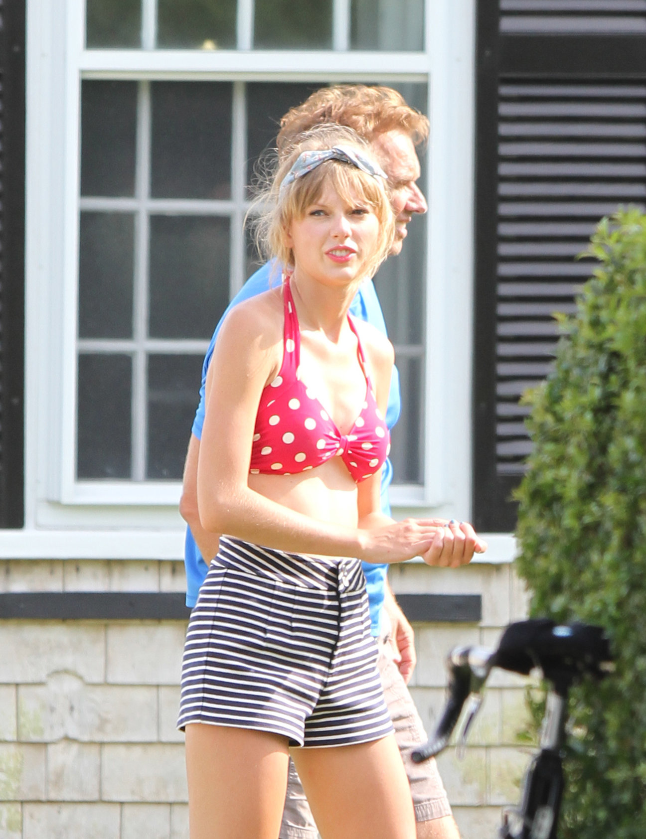 Taylor Swift wearing a bikini top and swimsuit in Hyannis on April 12, 2013