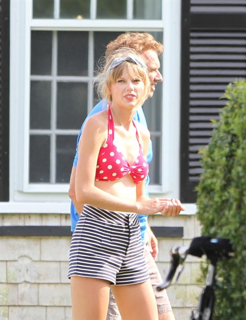 Taylor Swift wearing a bikini top and swimsuit in Hyannis on April 12, 2013