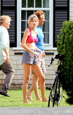Taylor Swift wearing a bikini top and swimsuit in Hyannis on April 12, 2013