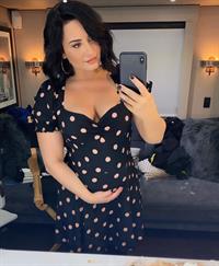 Demi Lovato Pictures Demi Lovato is playing a pregnant girl on Will and Grace looks pretty real she's also showing nice cleavage with her big boobs.