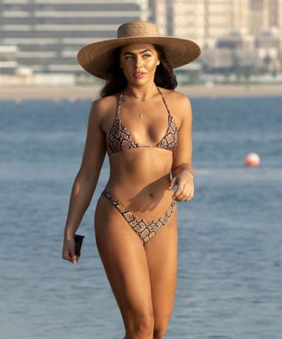 Francesca Allen sexy ass in a thong bikini also showing nice cleavage seen at the beach by paparazzi.