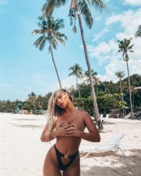 Rosanna Arkle topless holding her nude big boobs with hands on the beach and showing her sexy ass.